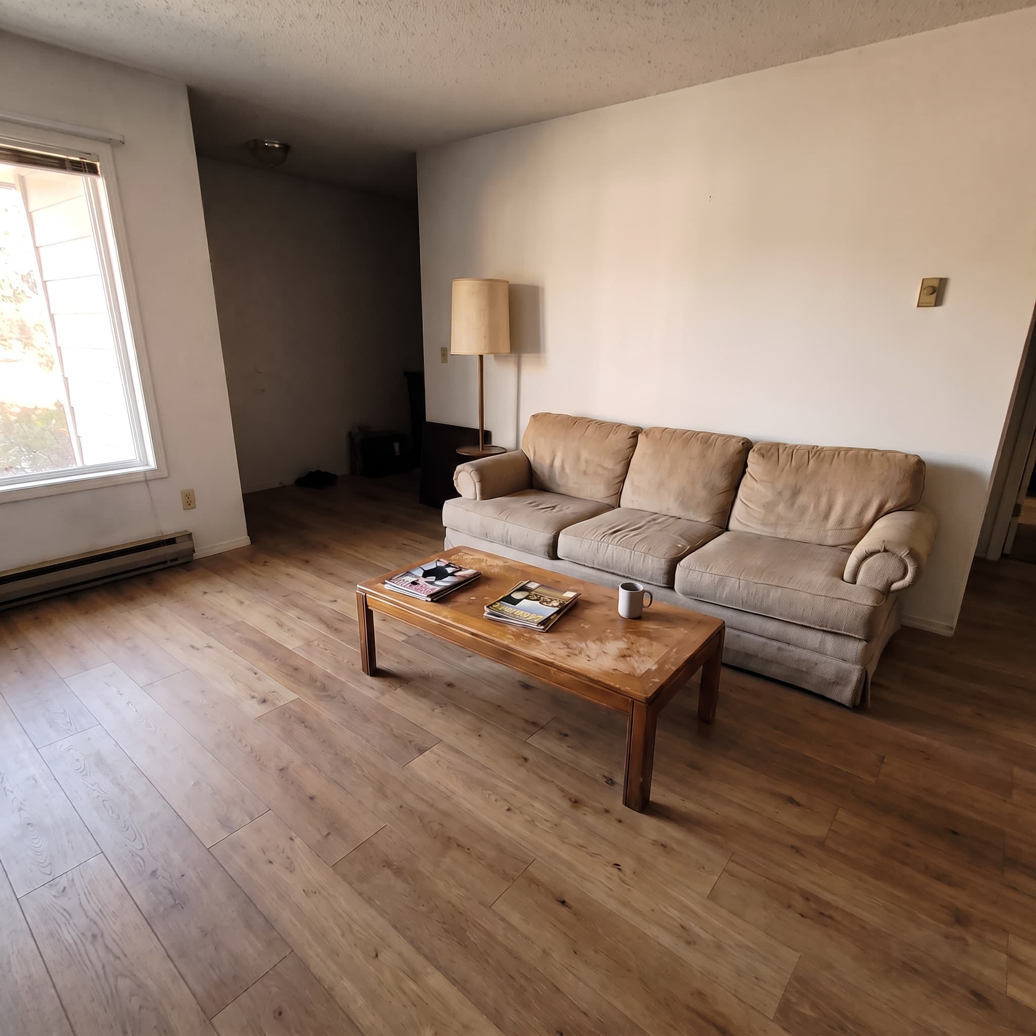 The living room, before and after — after